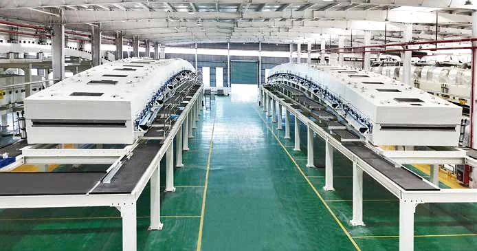 Two arched industrial drying ovens on a coating line in a factory