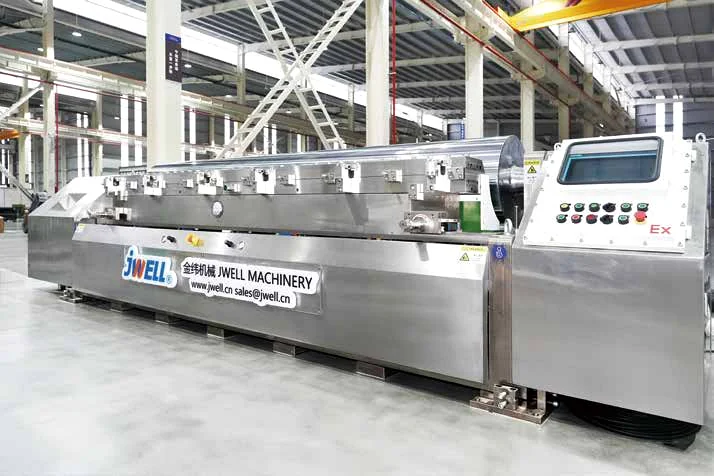 Stainless steel JWELL extrusion die with control console in a factory