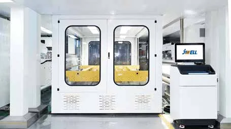 White enclosed coating machine with glass windows and a JWELL HMI console