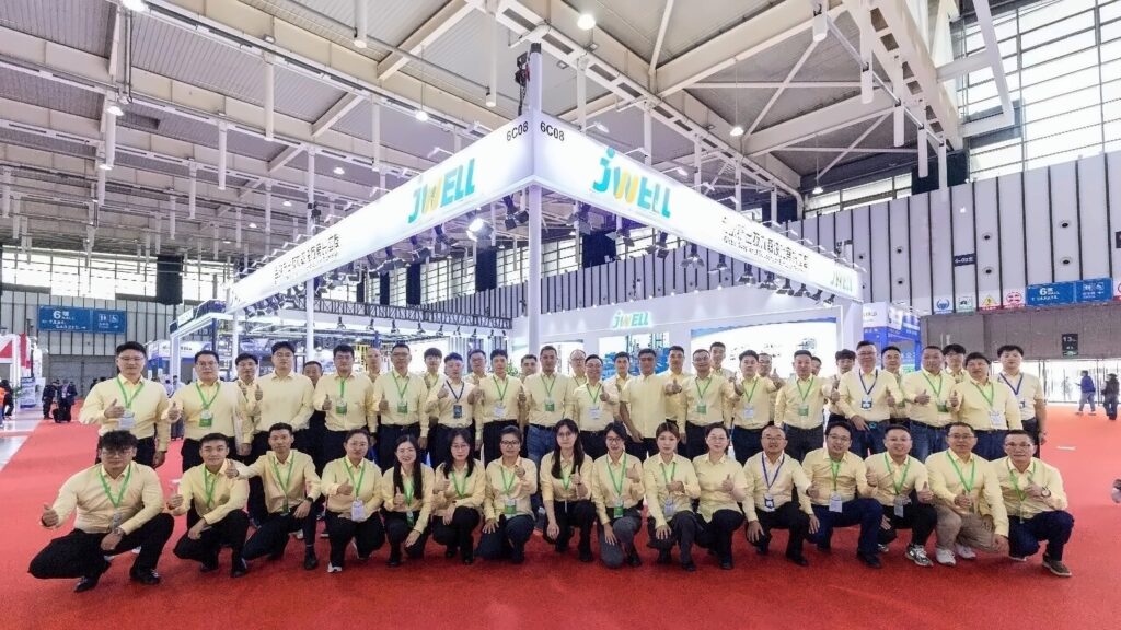 JWELL team group photo at exhibition booth C08 in Hall 6