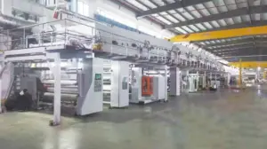 Coating production line in a factory with metallic film rolls