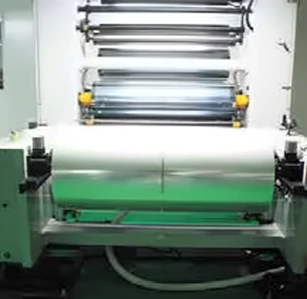 Industrial winding station with a large film roll and guide rollers